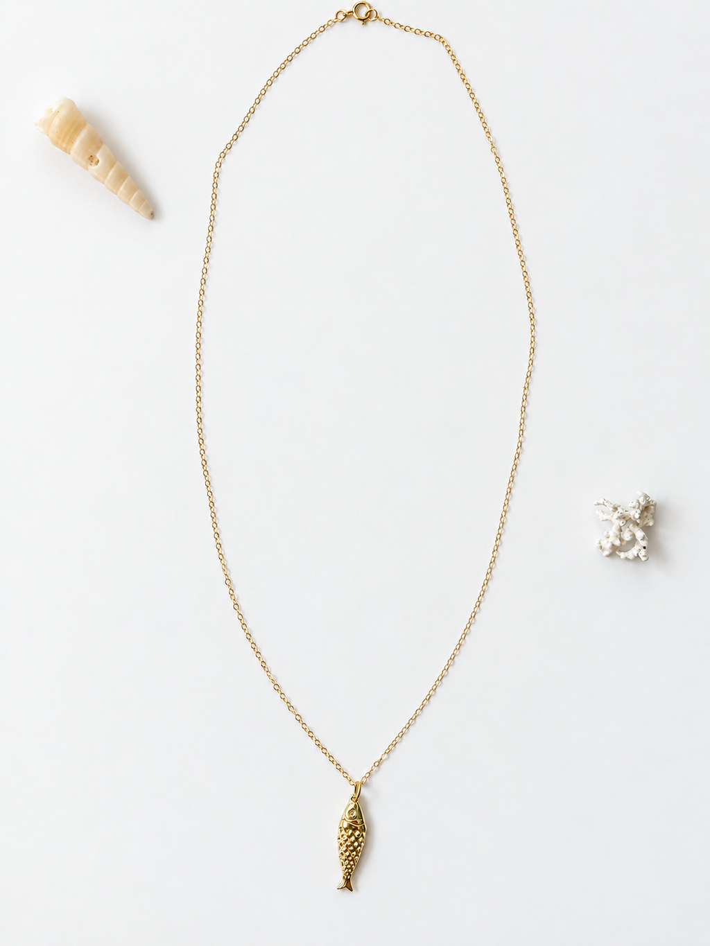 Gold-filled fish pendant necklace by Coastal Cloth Co.
