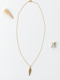 Gold-filled fish pendant necklace by Coastal Cloth Co.