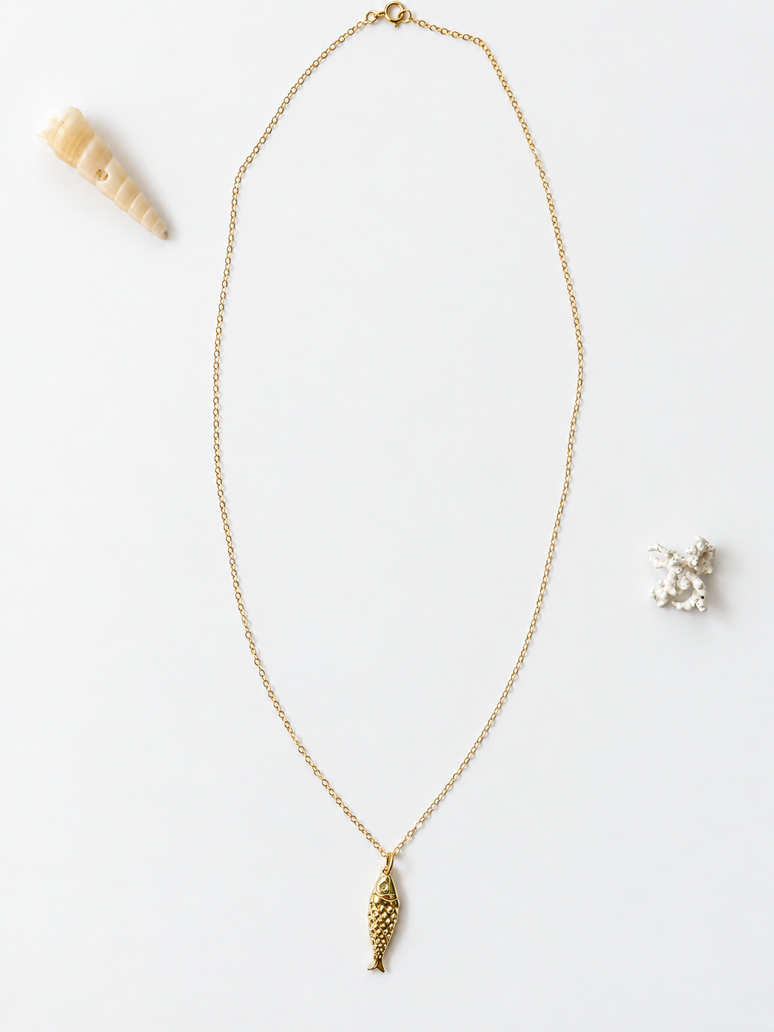 Gold-filled fish pendant necklace by Coastal Cloth Co.