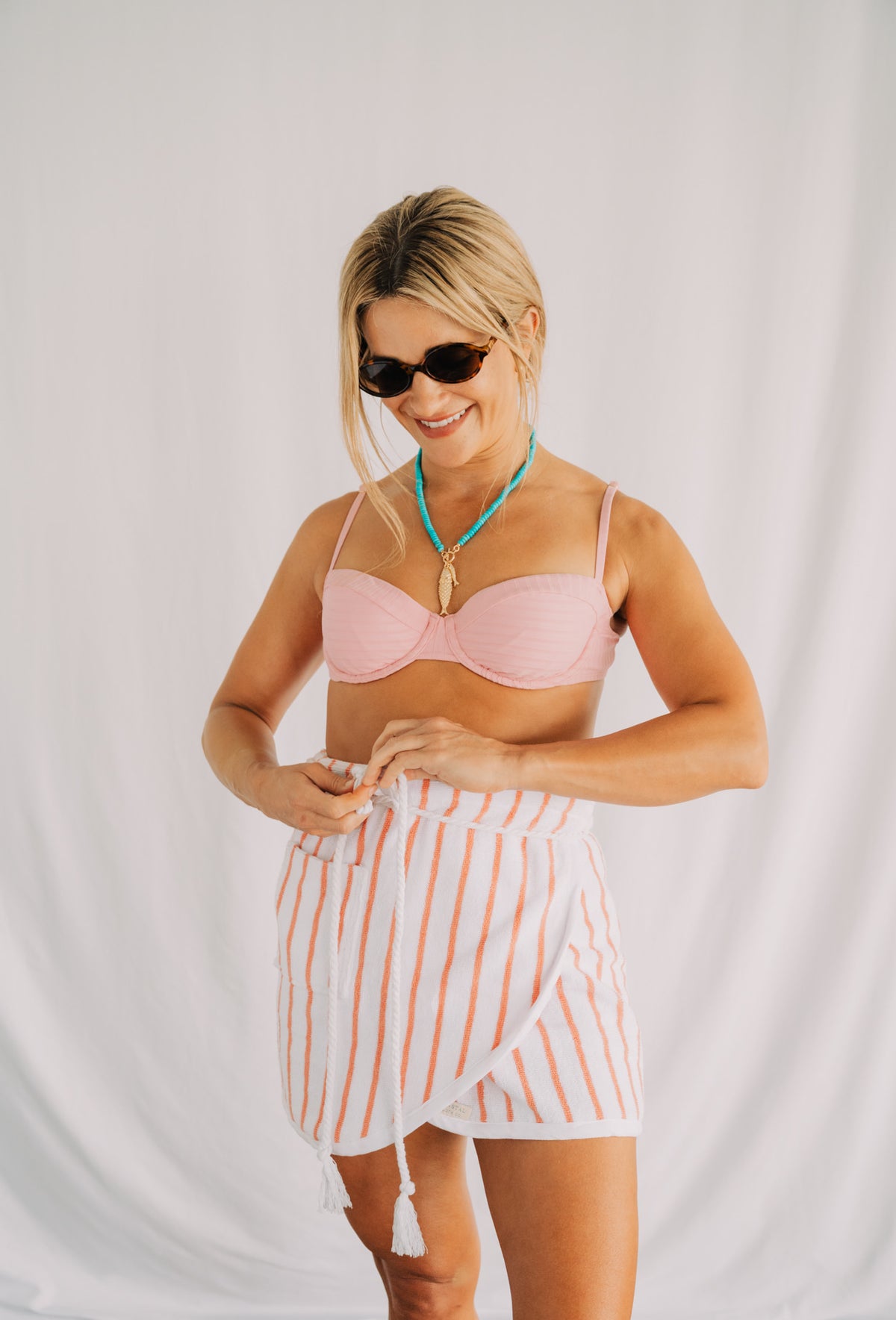 The Sullivan in Coral Stripe, an absorbent terry cloth towel wrap skirt